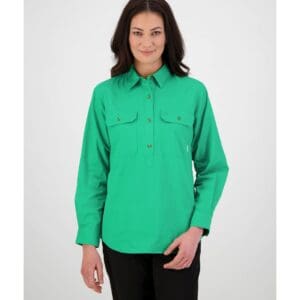 woman standing front on wearing swanndri's women's-roma-long-sleeve-shirt in green. 100% cotton, 152gsm Button flap chest pockets Half placket button opening Centre back box pleat